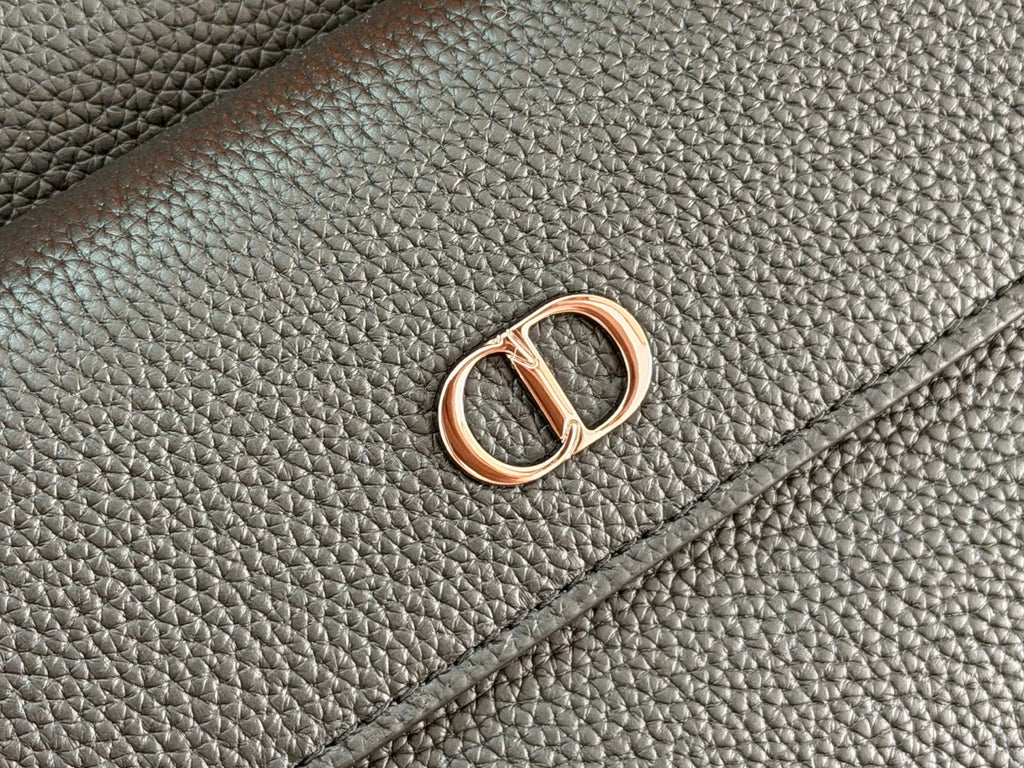 Dior logo charm on textured leather flap, gold and silver-tone hardware