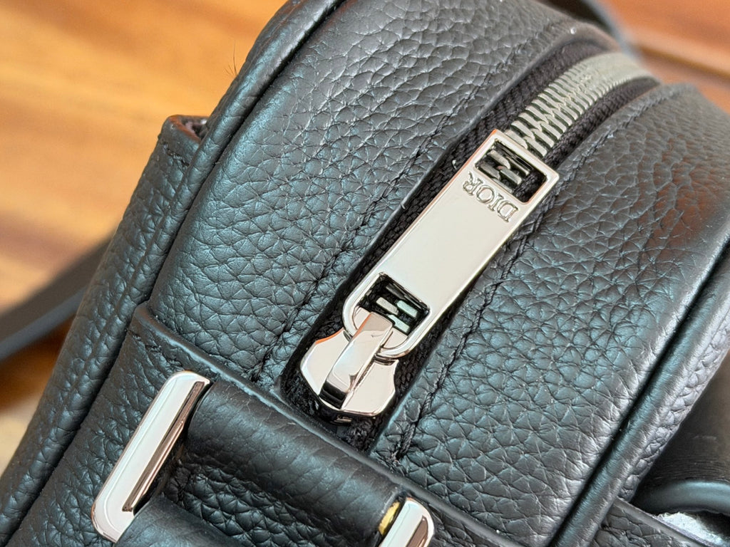Dior leather bag with metal turn-lock clasp and textured panel details