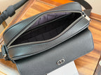 Dior crossbody bag open to interior view, showing lining and top zipper