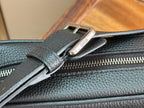 Dark blue bag zipper close-up with Dior-branded pull tab