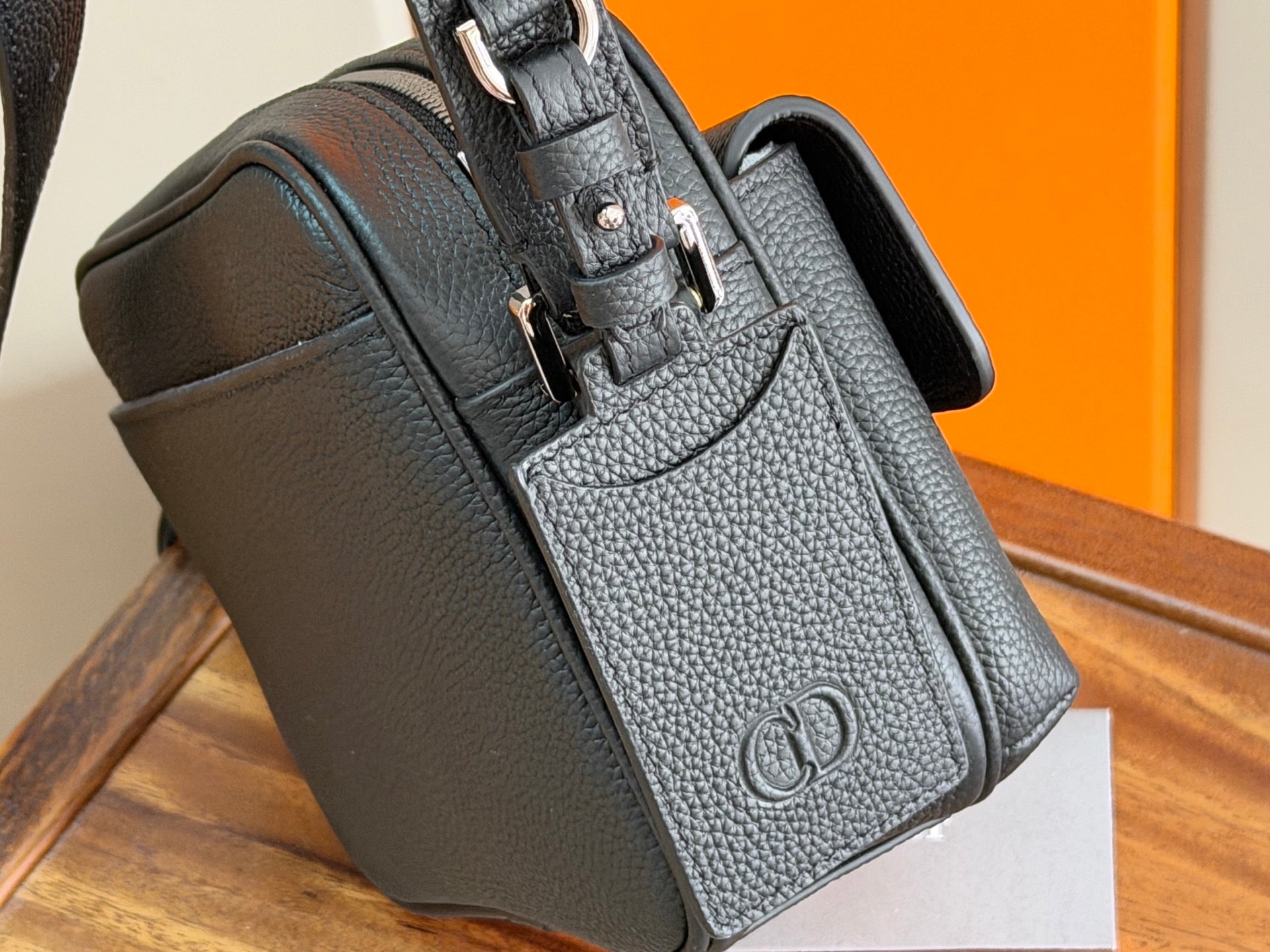 Dark blue top-handle and crossbody bag with metal logo