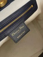 Christian Dior logo leather label on cream lining inside monogram bag