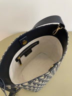 Interior view of navy-lined Dior monogram tote bag with zipper pocket