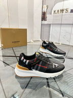 Black low-top sneakers with plaid side stripe and white midsole