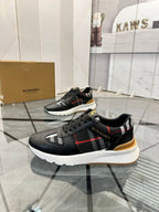 Black low-top sneakers with plaid side stripe, gum heel detail, chunky sole