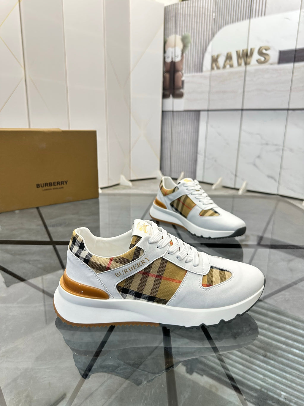 Burberry white sneakers with lace-up design and check panel accents on side and heel