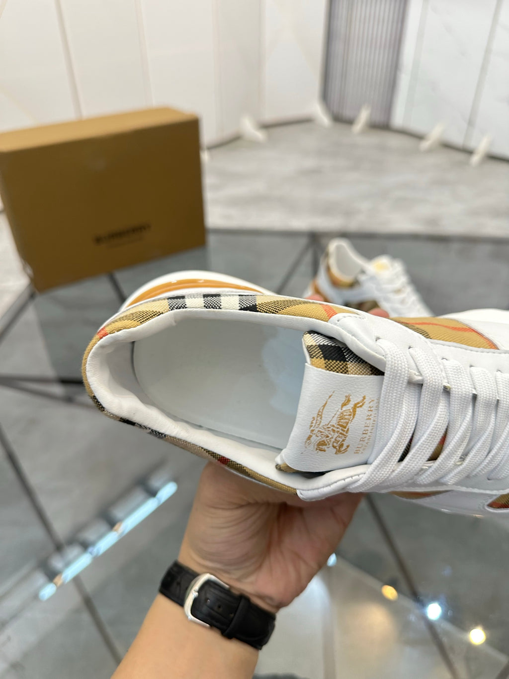 Burberry white sneaker close-up of back and heel, with laces and plaid detail
