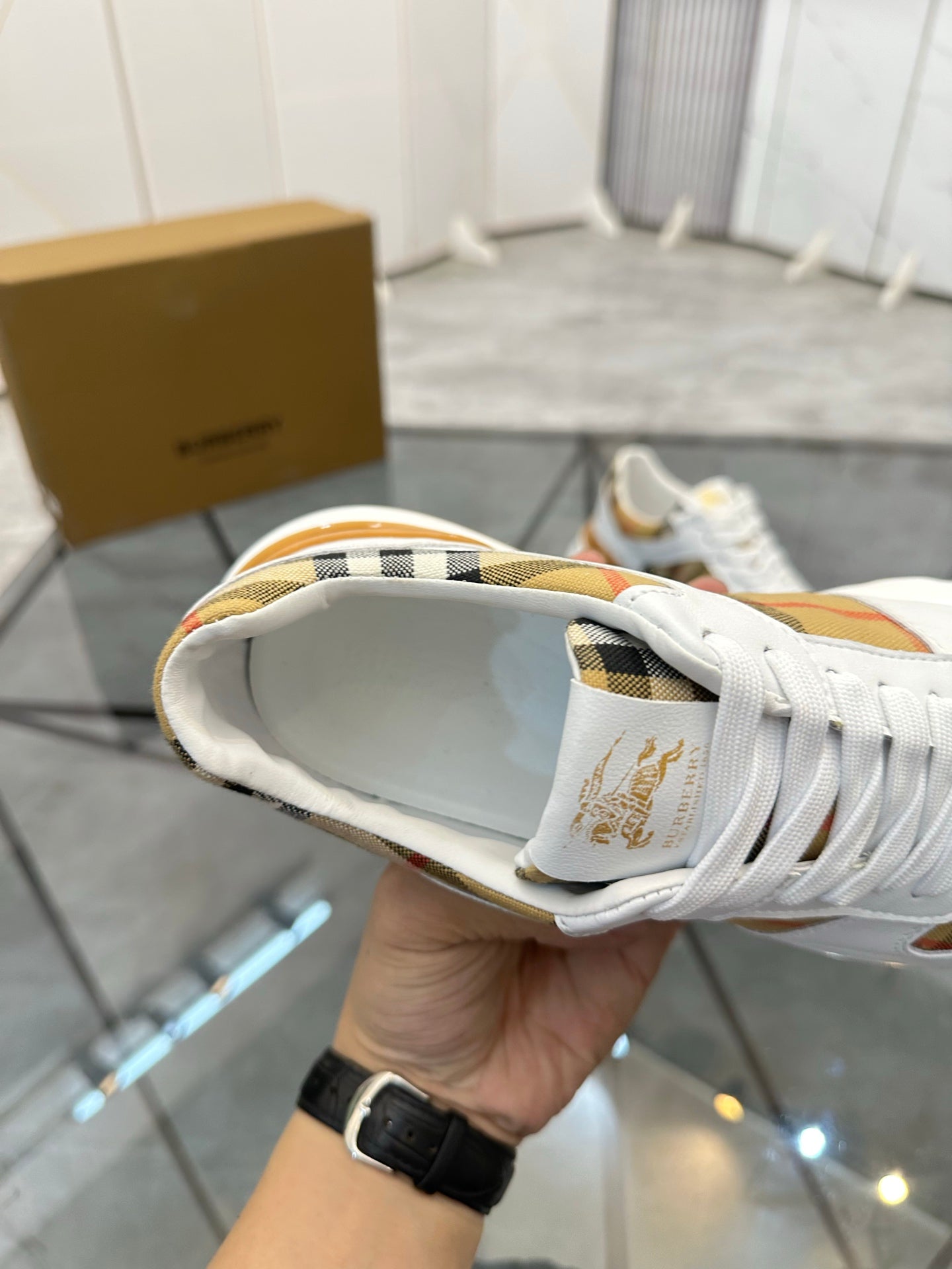 Burberry white sneaker close-up of back and heel, with laces and plaid detail