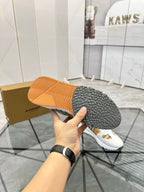 Burberry sneaker outsole tread held in hand, textured rubber sole