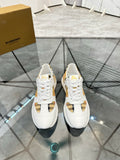 Burberry white sneakers with lace-up front, check panel accents, and gold-toned trim