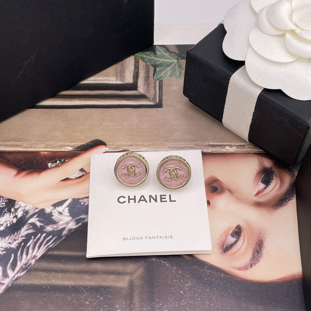 Chanel stud earrings with pink CC logo shown in a gift card
