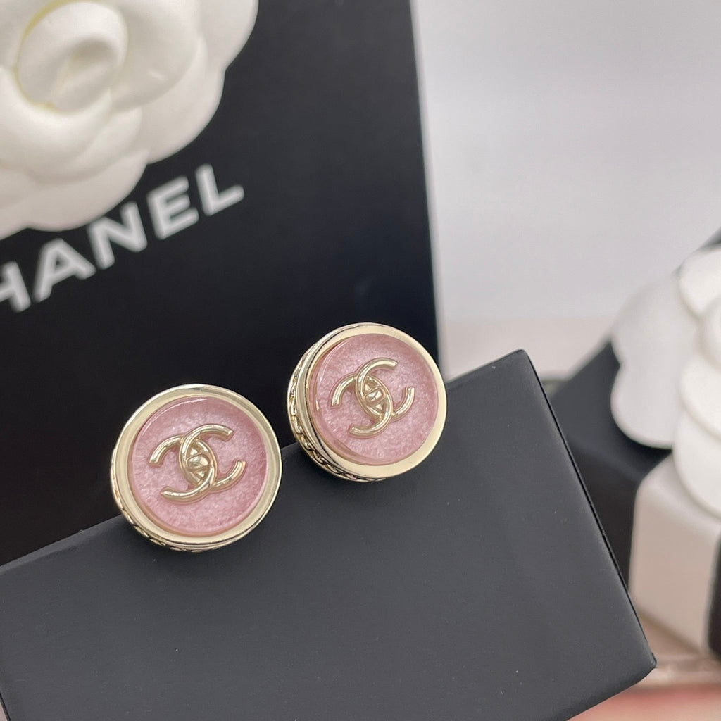 Pair of Chanel round stud earrings with pink CC logo medallions and gold trim