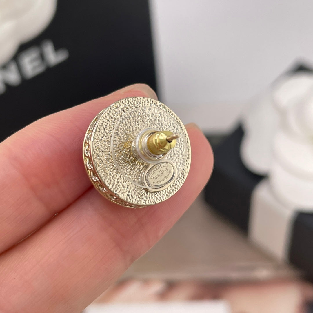 Back view of a Chanel round stud earring with gold-toned textured finish