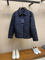 Louis Vuitton quilted long jacket in dark navy, full-zip front and stand collar