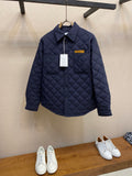 Navy quilted jacket with stand collar and button front