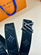 Dark navy leather belt strap with stitched LV star and monogram designs, buckle detail