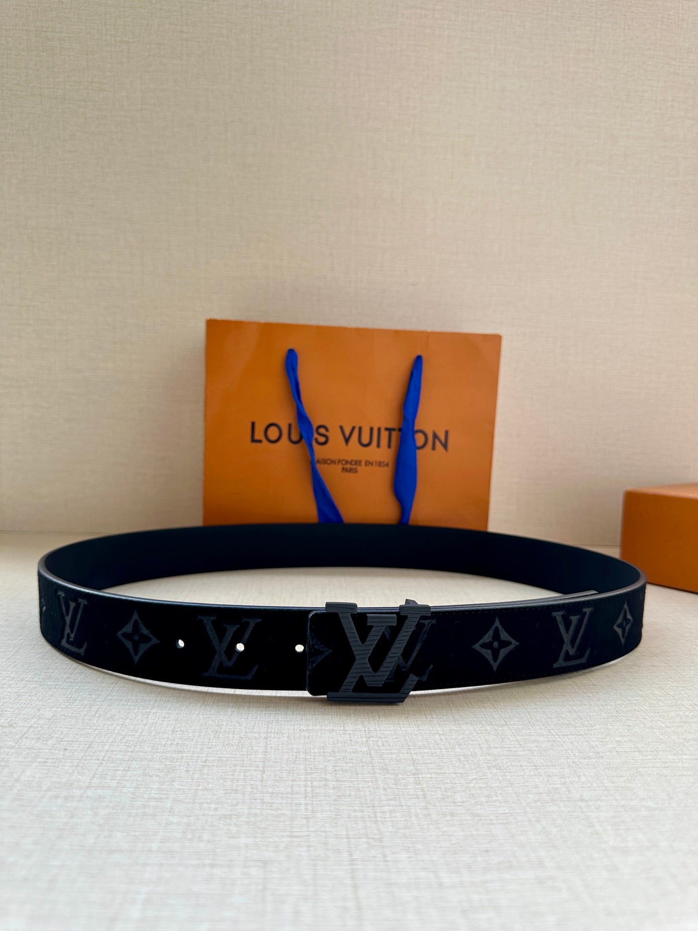 Louis Vuitton belt in dark navy leather with LV monogram and star pattern, square buckle
