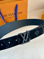 Dark navy leather belt with LV monogram panel and star motifs, rectangular buckle