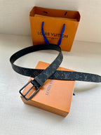 Louis Vuitton monogram belt with dark blue patterned strap, rectangular buckle, holes
