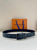 Louis Vuitton monogram belt with dark blue patterned strap and silver-tone buckle