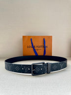 Louis Vuitton monogram belt with dark blue patterned strap and silver-tone buckle