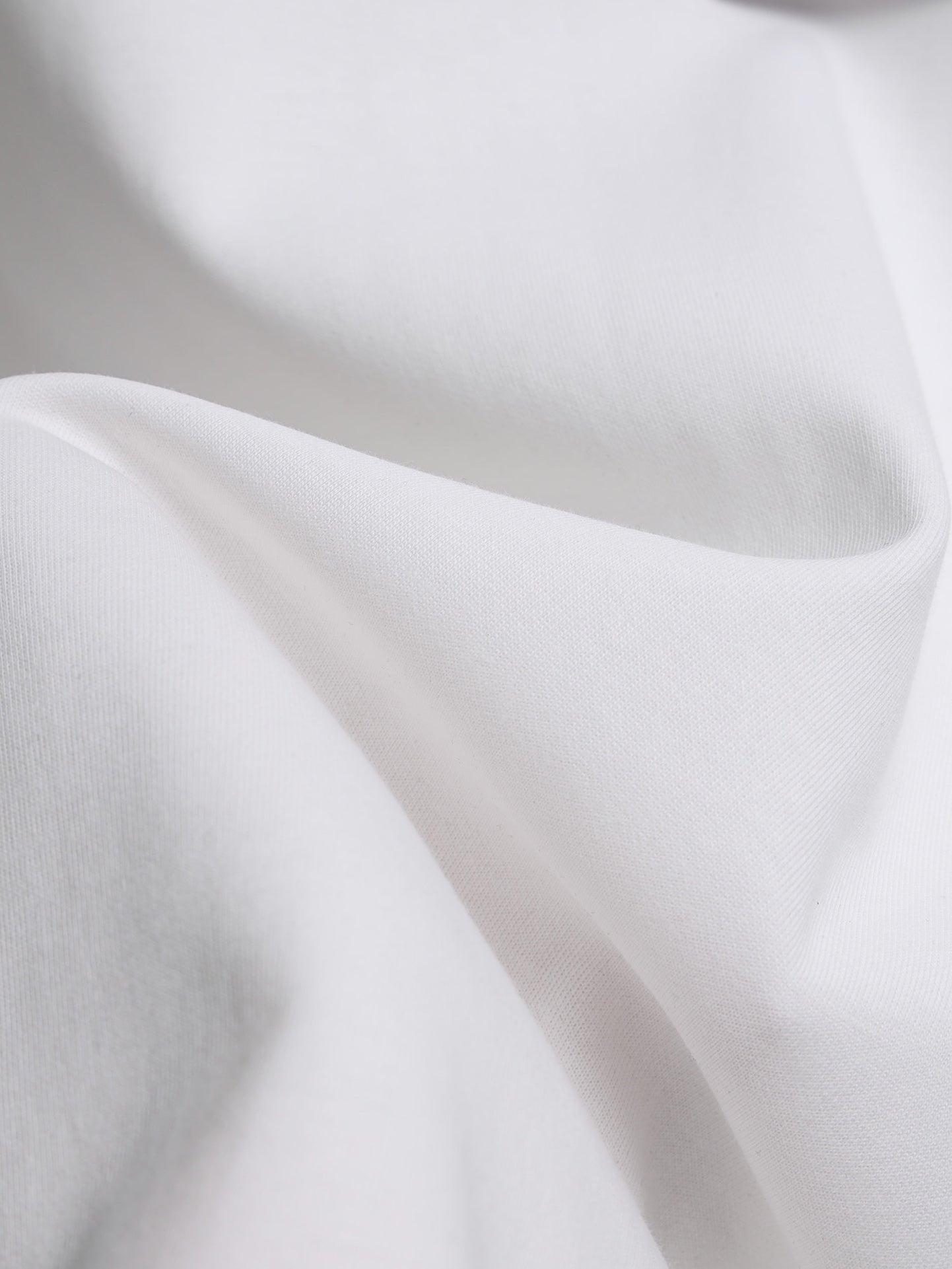 White T-shirt fabric close-up with soft knit texture
