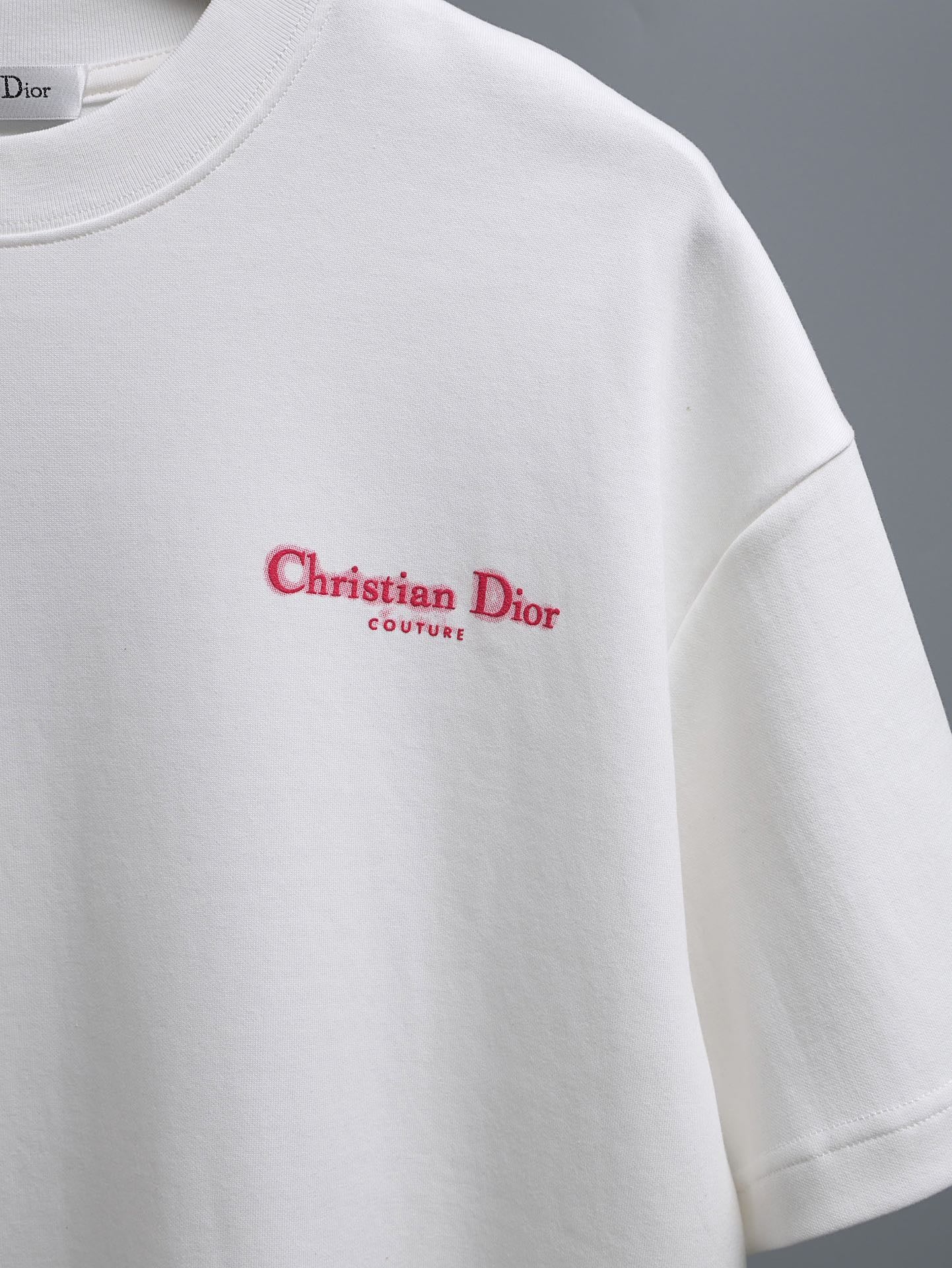 White T-shirt with red Christian Dior Couture logo print at center chest