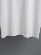 White T-shirt hem with clean stitched bottom edge