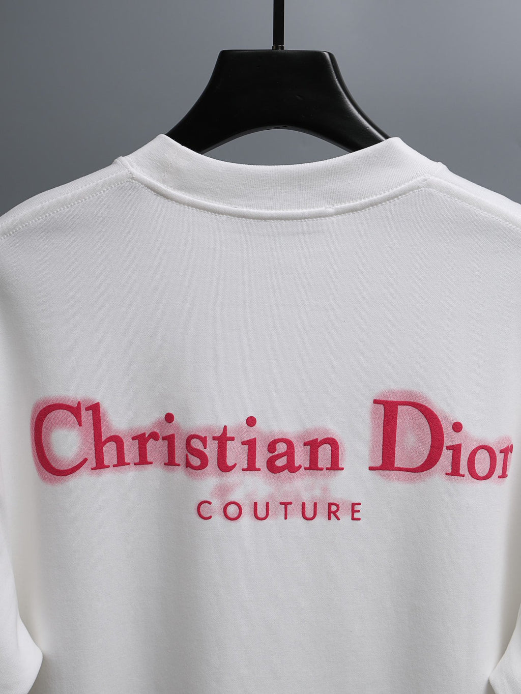 White T-shirt with large red Christian Dior Couture logo across back