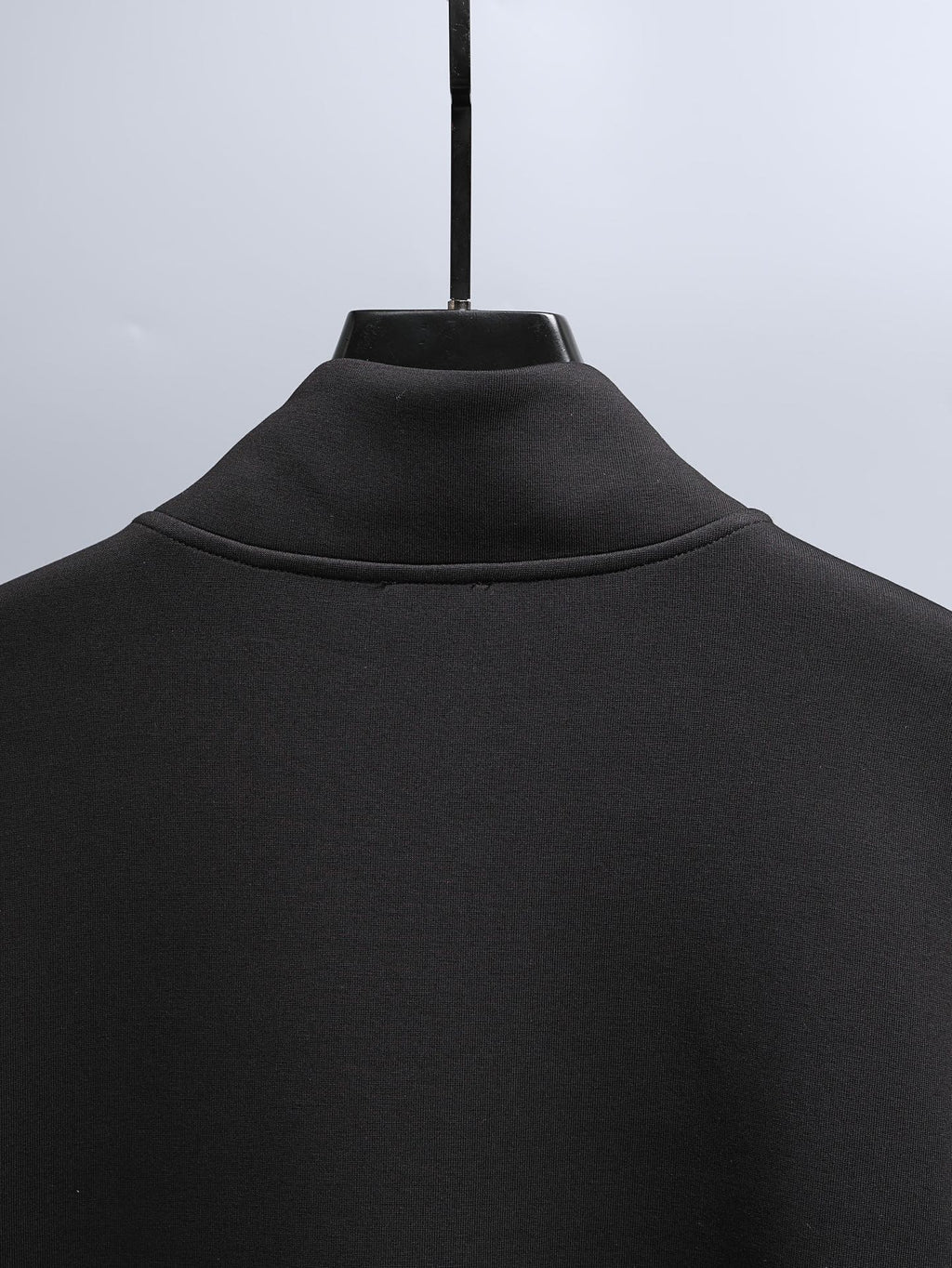 Black zip-up hoodie with ribbed stand collar