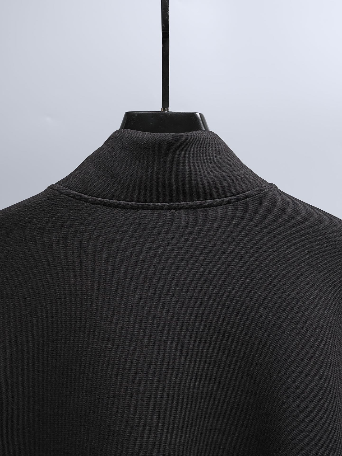 Black zip-up hoodie with ribbed stand collar