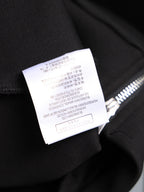 Black long-sleeve top sleeve cuff with size label, brushed fabric