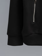 Black zip-up hoodie with curved hem and small silver side zipper