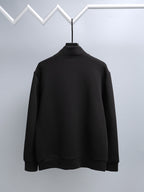 Black long-sleeve mock-neck top, full front view on hanger