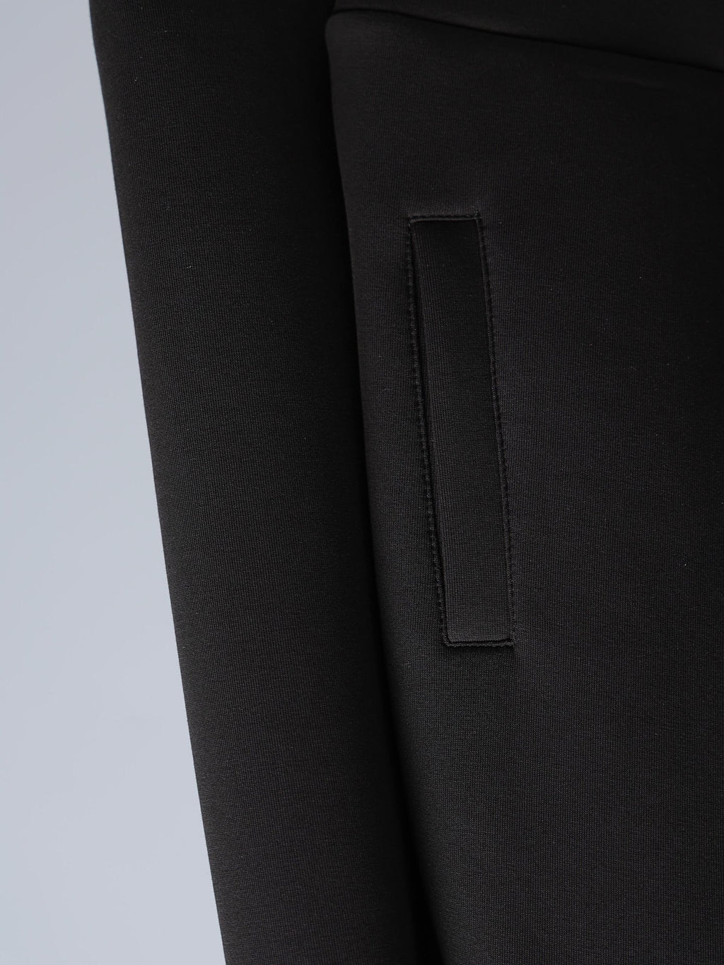 Black jacket with rectangular patch pocket and stitched trim