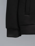 Black jacket sleeve with ribbed cuff and front pocket detail