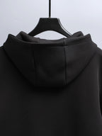 Black zip-up hooded jacket with hood and back seam