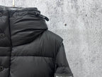 Quilted puffer jacket hood area and shoulder seam detail, dark fabric