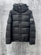 Long quilted puffer jacket with hood, front zipper, and Burberry England logo patch