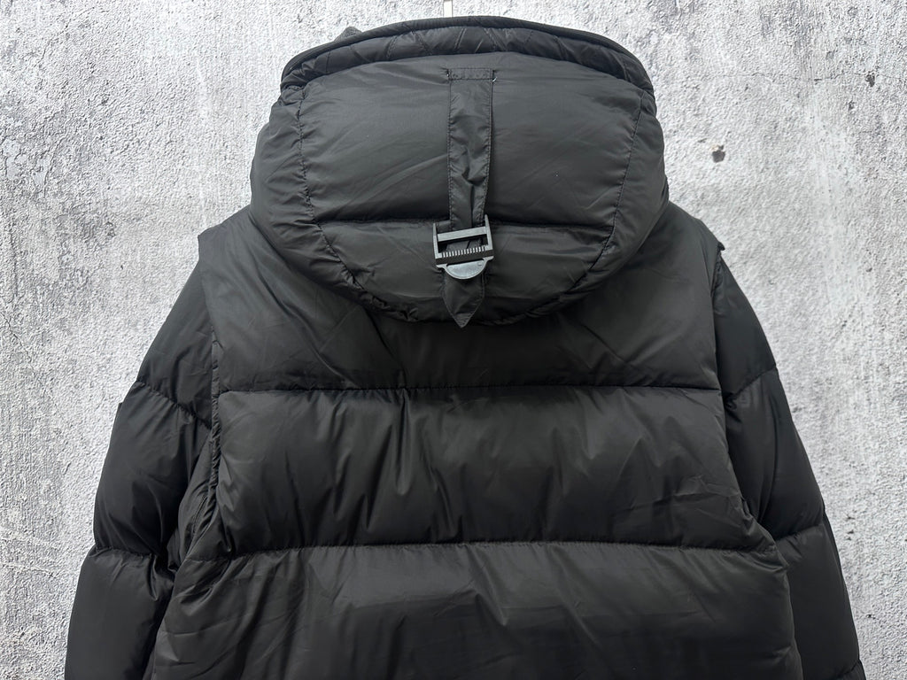 Long quilted puffer jacket with hood and adjustable strap detail, dark color