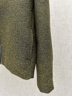 Olive textured jacket hem and side seam with flared silhouette