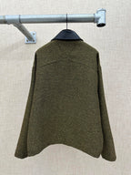 Olive textured jacket back view with structured shoulders and center back seam