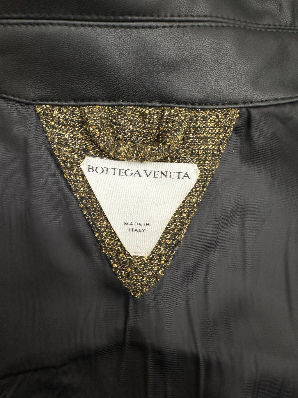 Dark jacket with gold sequin-trimmed V-neck and Bottega Veneta label