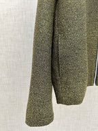Olive textured jacket sleeve and hem with flared cuff shape