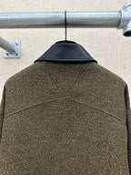 Olive textured jacket back with stitched yoke seam and center back drape
