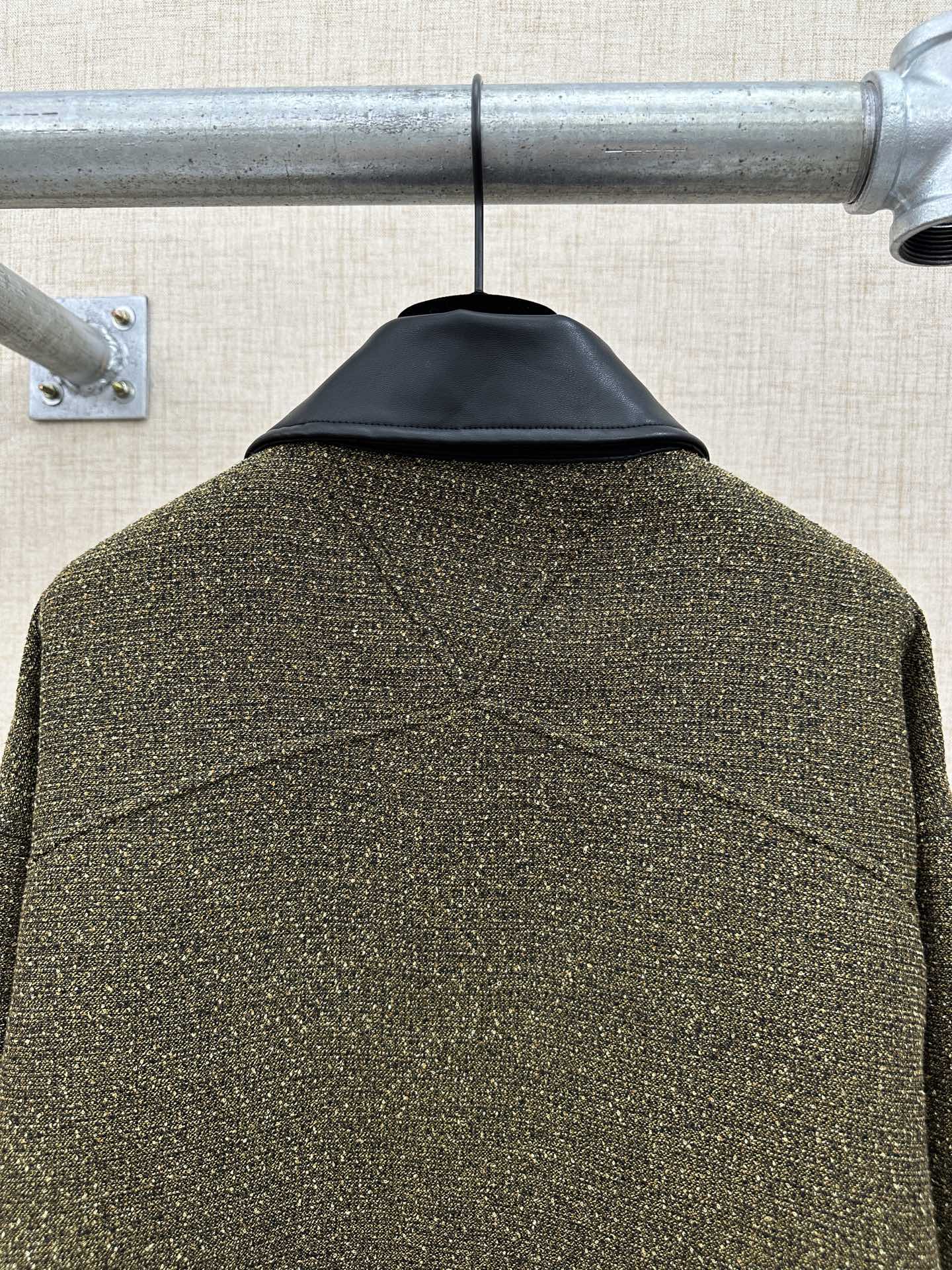 Olive textured jacket back with stitched yoke seam and center back drape