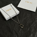 Dior charm necklace with silver-tone chain and dark enamel oval pendant