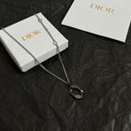 Dior charm necklace with silver-tone chain and dark enamel oval pendant