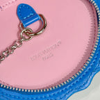 Louis Vuitton key pouch close-up, pink interior with logo print