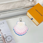 Louis Vuitton scallop mini pouch in pink with blue trim and metal keyring.